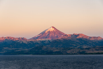 Sunrise at lago huechulafquen and peak of lanin volcano at lanin national park, patagonia, argentina