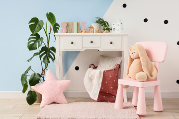 Interior of nursery with table, chair and toys
