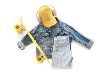 Composition with stylish children's clothes, headphones and skateboard on white background