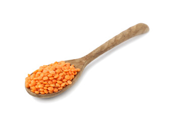 Raw lentils in wooden spoon isolated on white