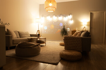 Interior of room with cartoon projection, sofas and glowing lamps