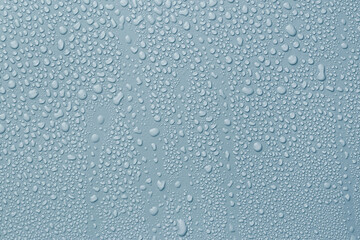 Many water drops on light blue background
