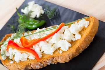 Image of delicious sandwich with young cheese and pepper