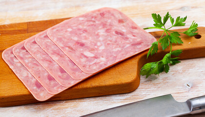Image of slicing chopped ham from pork meat