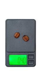 Roasted coffee beans being weighed on a precision scale expressed in grams