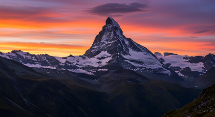 Majestic Matterhorn Peak at Sunrise with Colorful Sky Over Mountain Range