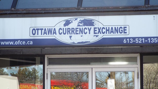 Ottawa, ON, Canada-April 19, 2025:The storefront sign for OTTAWA CURRENCY EXCHANGE on Bank street.