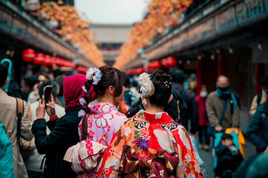 Young girl wearing Japanese kimono standing in front of Sensoji Temple in Asakusa Tokyo, Japan. Kimono is a Japanese traditional garment."kimono"