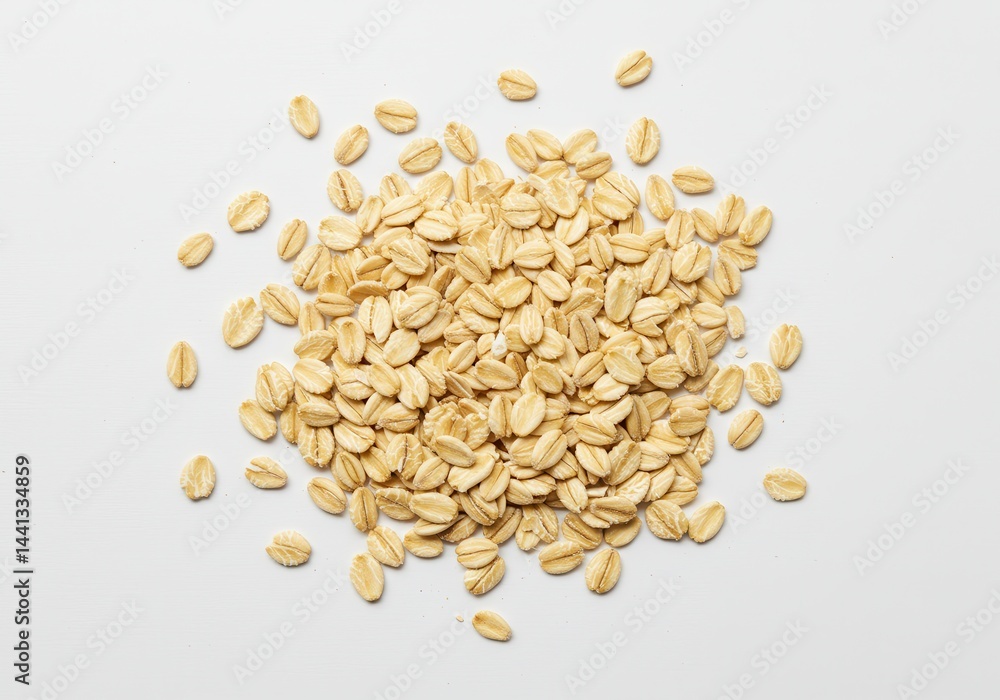 Poster a scattered pile of uncooked rolled oats on a plain white background in a studio setting shot overhe