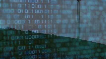 Wind turbine being animated on grassy hill at dusk, with binary code overlay in flat design - Powered by Adobe