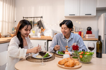 Asian young couple having dinner to celebrate valentine's day together. 