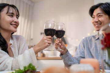 Asian young couple having dinner to celebrate valentine's day together. 
