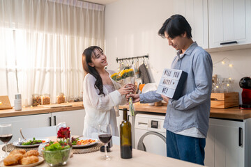 Asian romantic man surprise his girlfriend with a marriage proposal. 