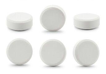 A close up shot of six white round pills arranged in a pattern on a white background surface view