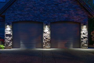 Garage door in luxury house with trees and nice landscape in Spring in Vancouver, Canada, North...