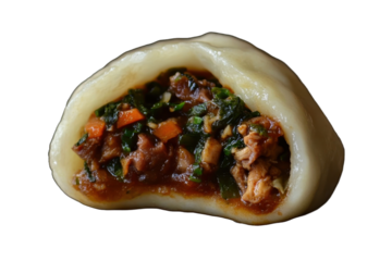 The image displays a cut-open steamed bun revealing a savory filling of meat and vegetables.