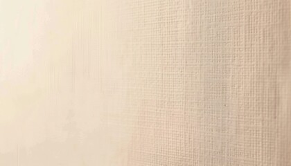 Fototapeta premium close-up texture of beige fabric with subtle woven pattern showing fine crisscross lines and soft lighting