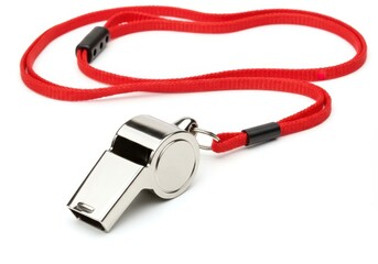 A shiny metal whistle with a red lanyard on a white background is displayed in a close up shot
