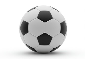 A soccer ball with black and white patches sitting on a white surface in a studio setting shot