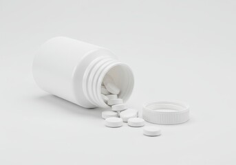 White pills spilling from a white bottle with the cap lying next to it on a white background surface
