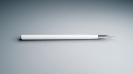 White pen on a gray surface