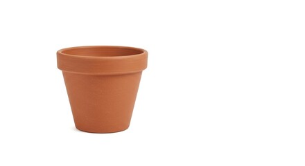A simple terracotta flower pot is displayed in a studio setting, ready for planting herbs, flowers, or succulents.
