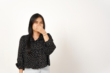 Smelling something stinky and disgusting Of Beautiful Asian Woman Wearing black Isolated On White...