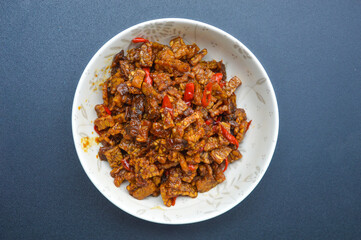 dish from indonesia kering tempe , made from tempe or soybeans cut into small pieces, cooked with chilies and soy sauce and other spices, tastes good and spicy
