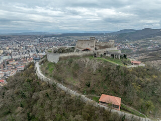 Aerial view of Deva Castle in Romania, partially restored hilltop noble residence, military...