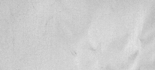 Crumpled shiny silver fabric metal texture background