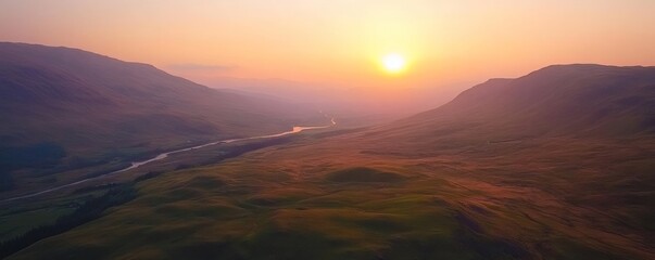 High-altitude view of a valley at sunrise.