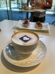 Cappuccino latte Coffee with heart in coffee patisserie shop italy