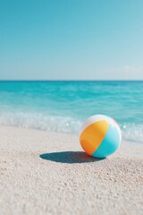 Obraz premium tranquil sandy beach scene with colorful beach ball casting shadow on sand