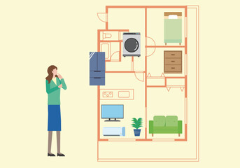 間取りと家具の配置を考える女性