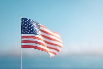 Obraz premium minimalistic american flag gently waving against soft-focus blue sky with ample copy space