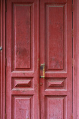 Fototapeta premium Red Wooden Double Door with Brass Handle in Vintage Style