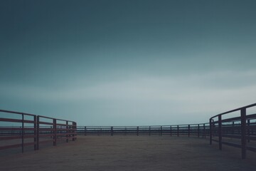Naklejka premium captured at dusk vast empty rodeo arena with wooden fencing enclosure stands under muted sky