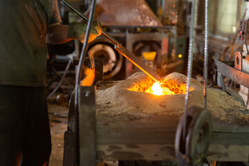 Ferrous metal billet is melted in an induction furnace closeup