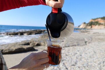 Obraz premium Seaside picnic thermos. High quality photo