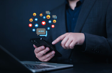 Social media and digital online, man using smart phone use social media network application, Friend reply chat concept or send emoticon for react feeling, playing Social media Distancing.