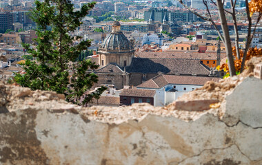 the center of Granada in Spain seen from the crack of an old wall