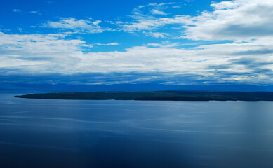 the calm splendid sea merges with the islands and the sky