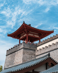 Historic architecture showcases traditional Chinese design against a vibrant blue sky in a scenic location