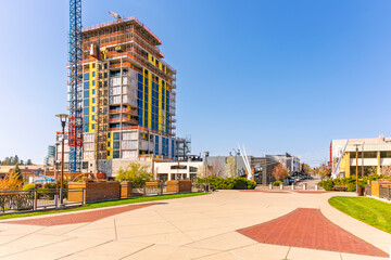 View from the Centennial Trail at Veterans Memorial Park of the historic downtown with new condominium construction along the lake in Coeur d'Alene, Idaho.
