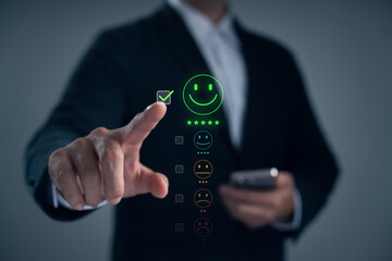 Businessman selecting excellent customer feedback with smiling face icon on digital screen, representing satisfaction, review, service quality, positive experience, online rating, user evaluation.