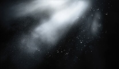 Sunlight illuminates floating dust particles in a dark space, creating a dramatic and ethereal atmosphere.