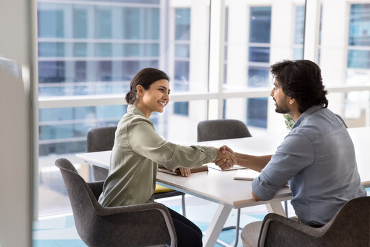 Happy client and lawyer finishing consultation with handshake, express respect and gratitude for getting professional services. Job interview process, applicant got hired, shake hands with HR manager