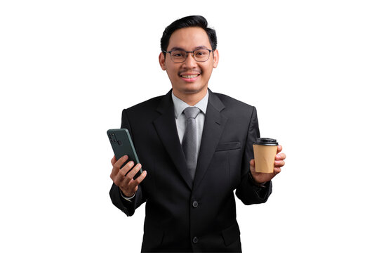 Happy Asian businessman in suit holding smartphone and coffee cup, smiling, isolated on transparent background