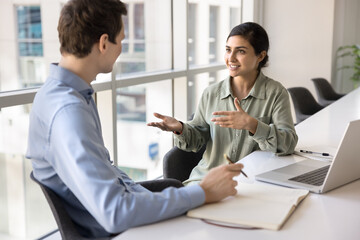 Indian female manager leads formal conversation with company client, sell services, making...