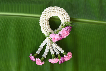 Fresh jasmine garland on banana leaves